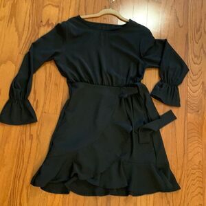 Size Medium Black long sleeve dress with Wrap around look.  NWOT